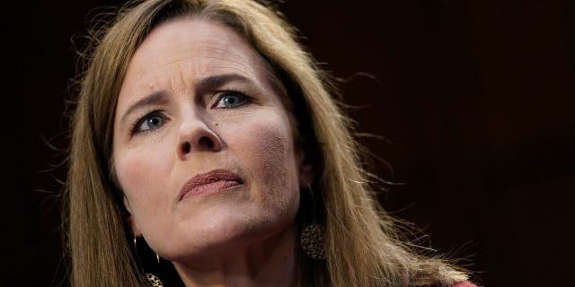 Supreme Court nominee Amy Coney Barrett listens during the second day of her confirmation hearing before the Senate Judiciary Committee.