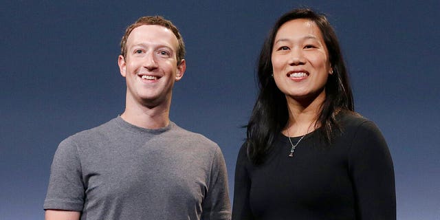 Facebook CEO Mark Zuckerberg and his wife, Priscilla Chan, smile as they prepare for a speech in San Francisco. 