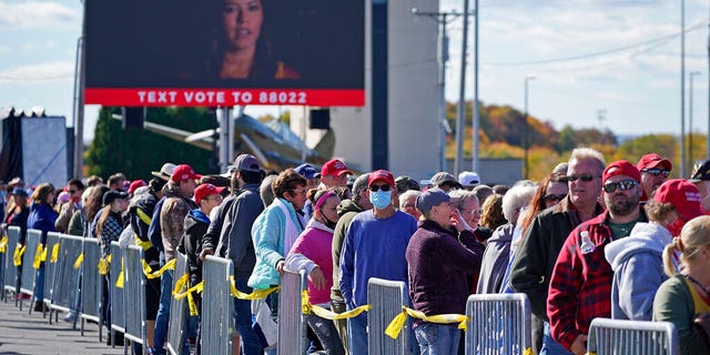 Supporters of President Donald Trump wait to enter a campaign rally Tuesday, Oct. 13, 2020, at John P. Murtha Johnstown-Cambria County Airport in Johnstown, Pa. (AP)