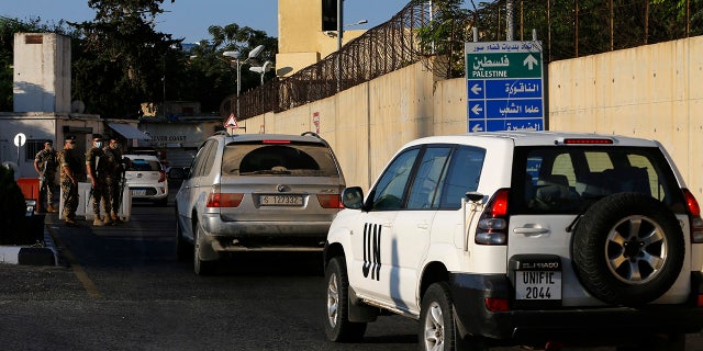 UNIFIL and civilian cars enter the headquarters of the U.N. peacekeeping force in the southern Lebanese border town of Naqoura, Lebanon, Wednesday, Oct. 14, 2020. (AP Photo/Bilal Hussein)