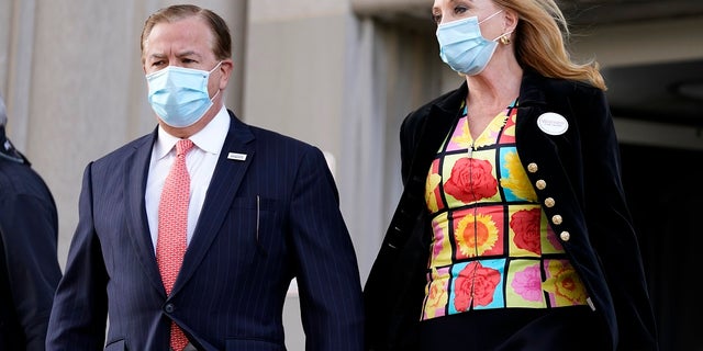 Mark and Patricia McCloskey leave following a court hearing Wednesday in St. Louis. (AP Photo/Jeff Roberson)
