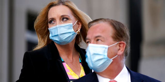FILE: Mark and Patricia McCloskey leave following a court hearing in St. Louis.