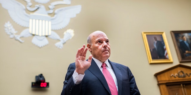 Postmaster General Louis DeJoy is sworn in before testifying during a House Oversight and Reform Committee hearing on Capitol Hill on Aug. 24. (Tom Williams/Pool Photo via AP, File)