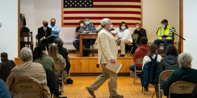 Lawyer and member of the Asatru Folk Assembly Allen Turnage returns to his seat, Wednesday, Oct. 14, 2020, in Murdock, Minn., after taking questions from the public and the council during a city council meeting for public discussion on the proposal to grant a permit to the Asatru Folk Assembly. (Renee Jones Schneider/Star Tribune via AP)