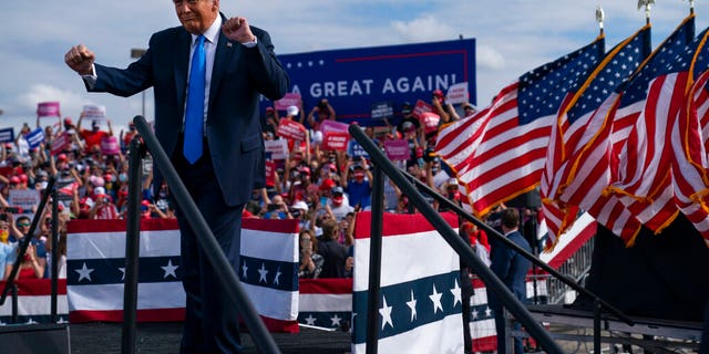 President Donald Trump dances as he walks off stage during a campaign rally at Pitt-Greenville Airport, Thursday, Oct. 15, 2020, in Greenville, N.C. (AP Photo/Evan Vucci)