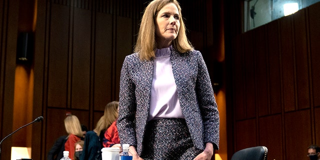 Supreme Court nominee Amy Coney Barrett departs during a break in a confirmation hearing before the Senate Judiciary Committee on Capitol Hill in Washington. (Stefani Reynolds/Pool via AP)