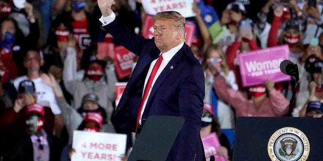 President Trump waves as he leaves after speaking at a campaign rally at Middle Georgia Regional Airport, Oct. 16, 2020, in Macon, Ga. (Associated Press)