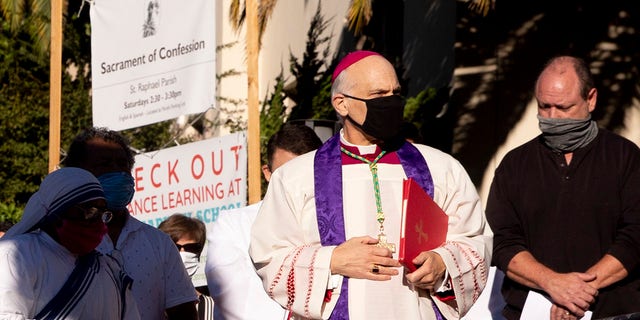 San Francisco's Archbishop Salvatore Cordileone conducts an exorcism Saturday, Oct. 17, 2020, outside Saint Raphael Catholic Church in San Rafael, Calif., on the spot where a statue of St. Junipero Serra was toppled during a protest on Oct. 12. (Associated Press)