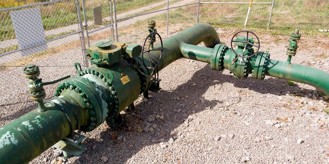 A MarkWest Liberty natural gas pipeline and fracking well cap is seen in Valencia, Penn. on Wednesday, Oc. 14, 2020. President Trump accuses Joe Biden of wanting to ban fracking, a sensitive topic in the No. 2 natural gas state behind Texas. (AP Photo/Ted Shaffrey)