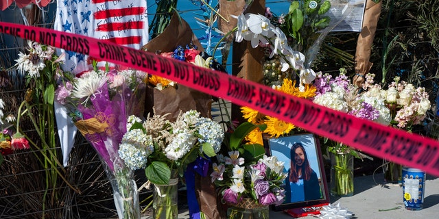 In this Sept. 8, 2019 file photo, red crime scene tape blocks off a memorial for the victims of the Conception dive boat fire on the Santa Barbara Harbor, as authorities issue a search warrant for the Truth Aquatics' offices on the Santa Barbara Harbor in Santa Barbara, Calif. (AP Photo/ Christian Monterrosa, File)