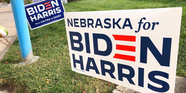 A Joe Biden presidential campaign sign greets passersby in a leafy neighborhood of Omaha, Neb., Oct. 19, 2020. (AP Photo/Grant Schulte)