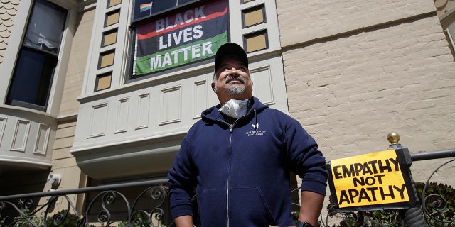 FILE - In this June 14, 2020, file photo, James Juanillo poses outside of his home in San Francisco. (AP Photo/Jeff Chiu, File)
