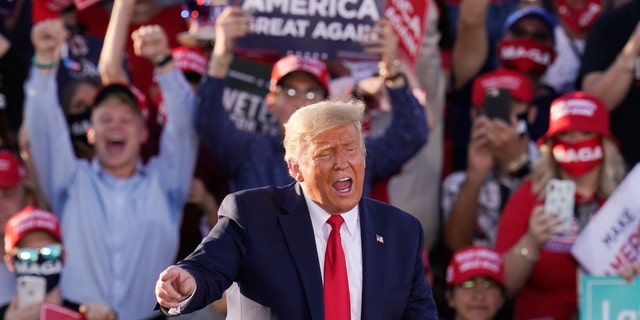 President Trump works the crowd after speaking at a campaign rally Monday, Oct. 19, 2020, in Tucson, Ariz. (AP Photo/Ross D. Franklin)