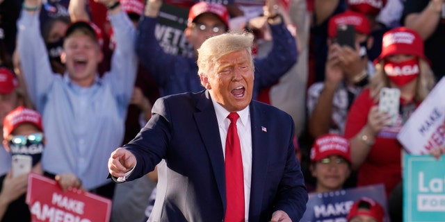 President Trump works the crowd after speaking at a campaign rally Monday, Oct. 19, 2020, in Tucson, Ariz. (AP Photo/Ross D. Franklin)