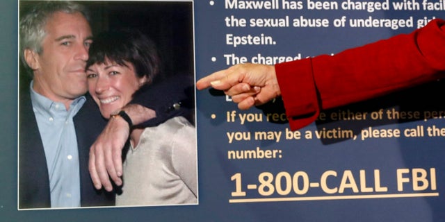 FILE - In this July 2, 2020, file photo, Audrey Strauss, acting United States Attorney for the Southern District of New York, points to a photo of Jeffrey Epstein and Ghislaine Maxwell during a news conference, in New York. (AP Photo/John Minchillo, File)