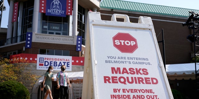 A sign greets visitors outside the Curb Event Center at Belmont University as preparations take place for the second Presidential debate, Tuesday, Oct. 20, 2020, in Nashville, Tenn., during the coronavirus outbreak. Governors of states including Tennessee, Oklahoma, Nebraska and North Dakota are all facing calls from doctors and public health officials to require masks. (AP Photo/Patrick Semansky)