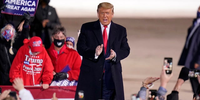 President Donald Trump arrives for a campaign rally at Erie International Airport, Tom Ridge Field in Erie, Pa, Tuesday, Oct. 20, 2020. (AP Photo/Gene J. Puskar)