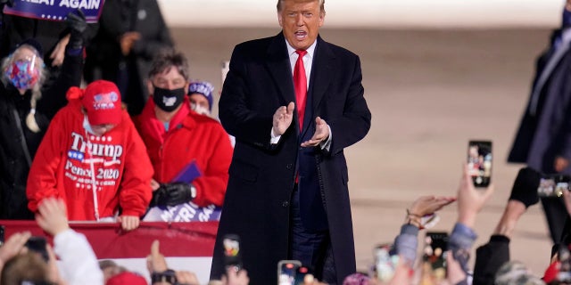 President Donald Trump arrives for a campaign rally at Erie International Airport, Tom Ridge Field in Erie, Pa, Tuesday, Oct. 20, 2020. (AP Photo/Gene J. Puskar)