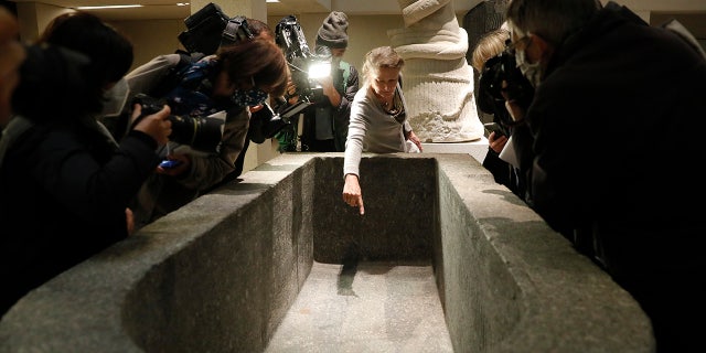 Frédéric Seifried, director of the Department of Antique Egypt, shows the media a stain from the liquid inside the Sarcofurg of Hell Museum on Wednesday, Wednesday, October 21, 2020, in Berlin. (AP Photo / Marcus Greiber)