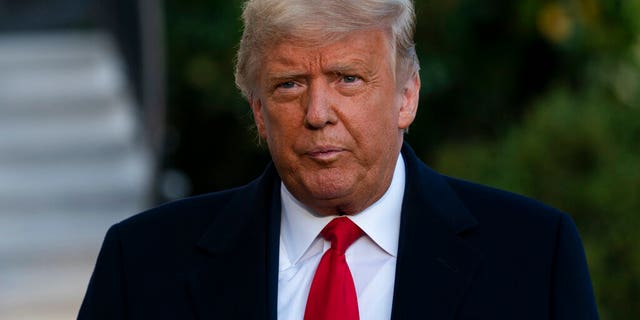 President Donald Trump speaks with reporters as walks to board Marine One on the South Lawn of the White House, Wednesday, Oct. 21, 2020, in Washington. Trump is en route to North Carolina. (AP Photo/Alex Brandon)