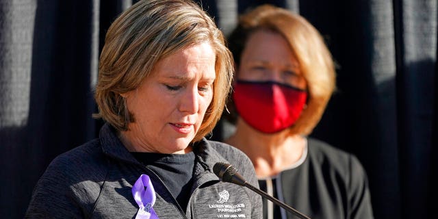 University of Utah President Ruth Watkins, right, looks on as Jill McCluskey, the mother of slain University of Utah student-athlete Lauren McCluskey speaks during a press conference announcing they have reached a settlement.