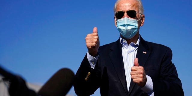 Democratic candidate former Vice President Joe Biden speaks to reporters before boarding his campaign plane at New Castle Airport in New Castle, Del., Oct. 22, en route to Nashville, Tenn., for the final presidential debate against Republican candidate President Donald Trump. (AP Photo/Carolyn Kaster)