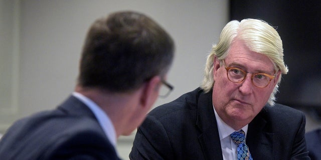 Christopher Hug, right, administrator for the Fotis Dulos estate, talks with his attorney, Paul Knierim, during a hearing at Farmington Regional Probate Court on Thursday in Farmington, Conn. (H John Voorhees III/Hearst Connecticut Media via AP)