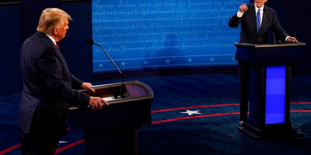 Former Vice President Joe Biden, right, spars with President Donald Trump during the second and final presidential debate on Thursday, Oct. 22, 2020. (AP Photo/Morry Gash, Pool)