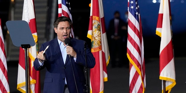 Florida Gov. Ron DeSantis speaks before President Donald Trump at a campaign rally in Pensacola, Fla., last week. His address was illegally changed and found out Monday when he tried to cast a ballot. (AP Photo/Gerald Herbert)