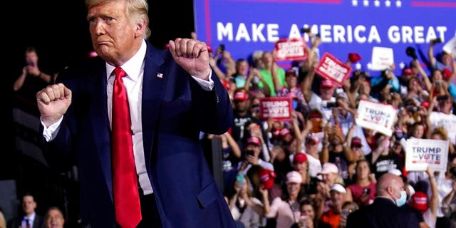 President Donald Trump dances after a campaign rally at Pensacola International Airport, Friday, Oct. 23, 2020, in Pensacola, Fla. (AP Photo/Evan Vucci)