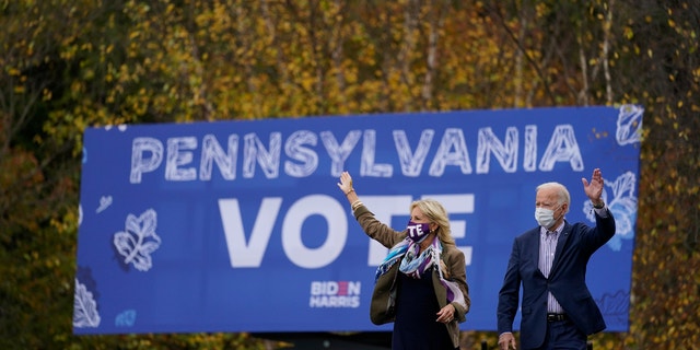 Democratic presidential candidate former Vice President Joe Biden and his wife Jill Biden arrive at a campaign stop at Bucks County Community College, Saturday, Oct. 24, 2020, in Bristol, Pa. (AP Photo/Andrew Harnik)