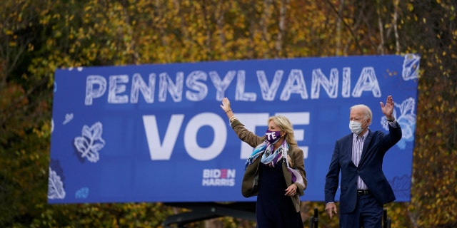 Democratic presidential candidate former Vice President Joe Biden and his wife Jill Biden arrive at a campaign stop at Bucks County Community College, Saturday, Oct. 24, 2020, in Bristol, Pa. (AP Photo/Andrew Harnik)