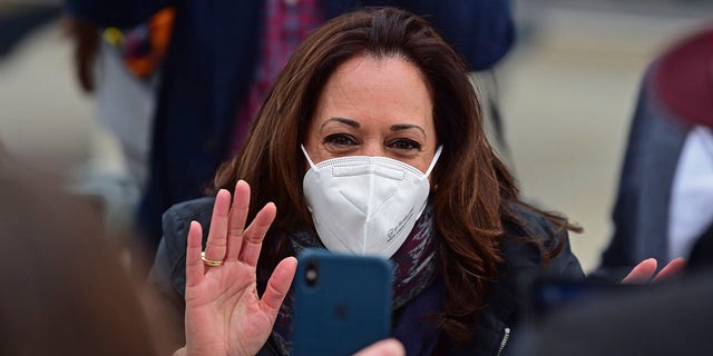 Democratic vice presidential candidate Sen. Kamala Harris, D-Calif., waves to a cell phone during a campaign event, Saturday, Oct. 24, 2020, in Cleveland. (Associated Press)