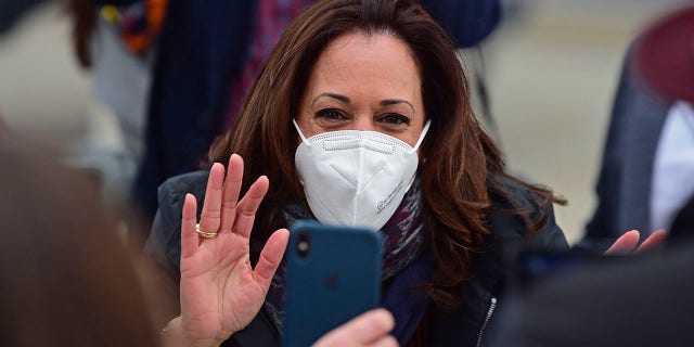 Democratic vice presidential candidate Sen. Kamala Harris, D-Calif., waves to a cell phone during a campaign event, Saturday, Oct. 24, 2020, in Cleveland. (Associated Press)