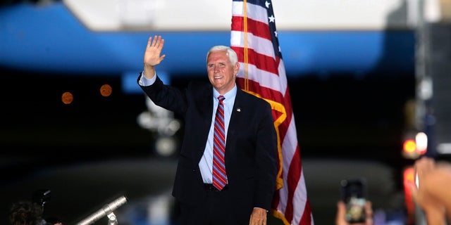 Vice President Mike Pence waves to supporters Saturday Oct. 24, 2020, in Tallahassee, Fla. (AP Photo/Steve Cannon)