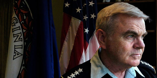 Army Gen. J.H. Binford Peay III, superintendent of the Virginia Military Institute, looks out the window of his office in Lexington, Va., in this April 26, 2007, photo. He has since resigned, the school's board president announced in a statement Monday, Oct. 26, 2020. (Bob Brown/Richmond Times-Dispatch via AP)