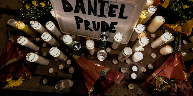 In this Sept. 2, 2020, file photo, candles light a makeshift memorial for Daniel Prude, a Black man who died while restrained and in police custody in Rochester, N.Y., in March.  (AP Photo/Adrian Kraus, File)