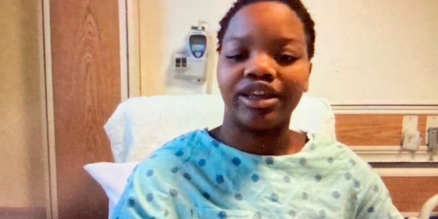 In this image taken from a video screen, Tafara Williams speaks to reporters from her hospital bed during a Zoom meeting Tuesday, Oct. 27, 2020 in Libertyville, Ill. (Zoom via AP Photo)