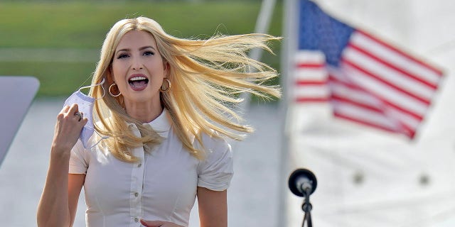 Ivanka Trump, daughter and adviser to President Donald Trump, removes her protective mask as she takes the stage before a campaign event Tuesday, Oct. 27, 2020, in Sarasota, Fla. (Associated Press)