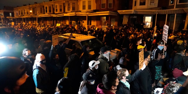 Protesters confront police during a march Oct. 27, in Philadelphia. (AP Photo/Matt Slocum)