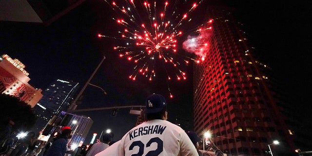 Baseball fans celebrate downtown after the Los Angeles Dodgers won the World Series over the Tampa Bay Rays Tuesday, Oct. 27, 2020, in Los Angeles. (AP Photo/Ashley Landis)