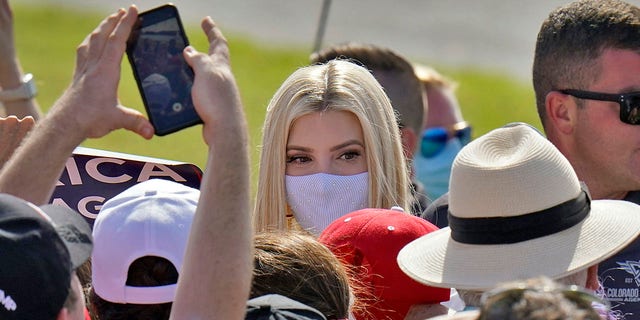 Ivanka Trump, daughter and adviser to President Donald Trump, wears a protective mask as she greets supporters along a rope line after a campaign event Tuesday, Oct. 27, 2020, in Sarasota, Fla. (AP Photo/Chris O'Meara)
