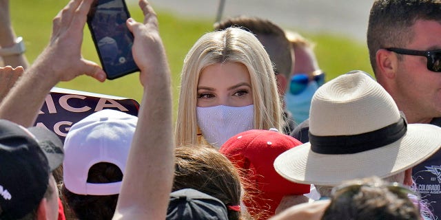 Ivanka Trump, daughter and adviser to President Donald Trump, wears a protective mask as she greets supporters along a rope line after a campaign event Tuesday, Oct. 27, 2020, in Sarasota, Fla. (AP Photo/Chris O'Meara)