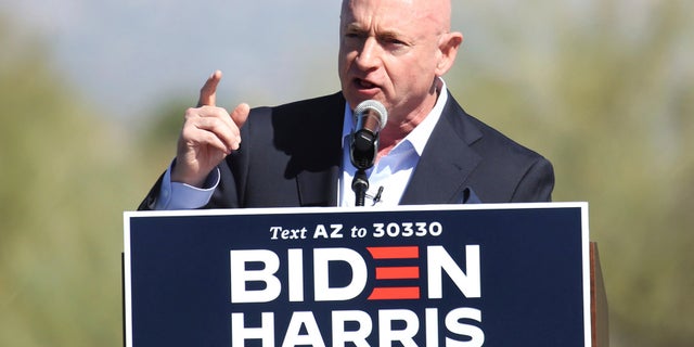 Democratic U.S. Senate candidate Mark Kelly speaks during a drive-in campaign rally at Pima Community College West in Tucson, Ariz., Wednesday, Oct. 28, 2020. (Mamta Popat/Arizona Daily Star via AP)