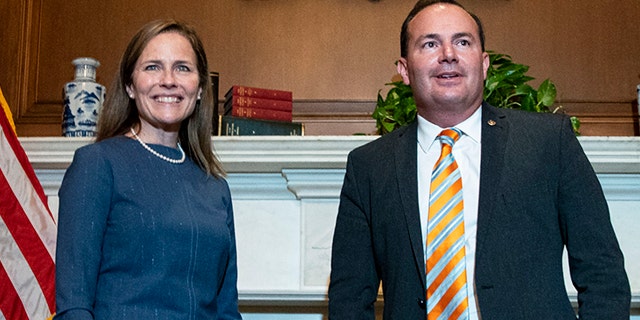 Judge Amy Coney Barrett, President Donald Trump's nominee to the Supreme Court, meets with Sen. Mike Lee, R-Utah, at the Capitol, Tuesday, Sept. 29, 2020 in Washington. (Al Drago/Pool via AP)