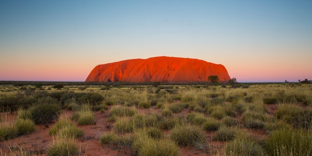 The "flight to somewhere" will include an overnight stay at a resort hotel near Uluru in Australia's Northern Territory.