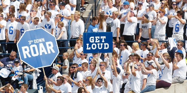 FILE - In this Sept. 16, 2017, file photo, BYU fans cheer in the first half during an NCAA college football game against Wisconsin, in Provo, Utah. (AP Photo/Kim Raff, File)