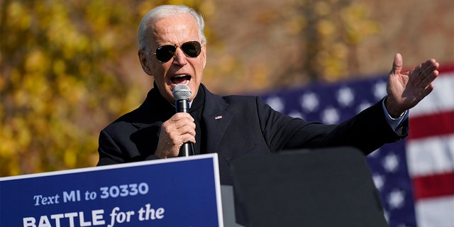 Democratic presidential candidate former Vice President Joe Biden speaks at a rally, also attended by former President Barack Obama, at Northwestern High School in Flint, Mich., Saturday, Oct. 31, 2020. (AP Photo/Andrew Harnik)