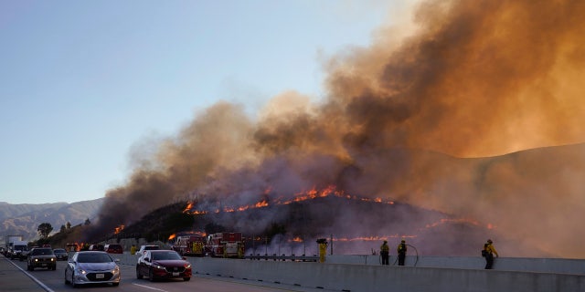 Crews tried to beat back two out-of-control wildfires in Southern California that have kept tens of thousands of people out of their homes.