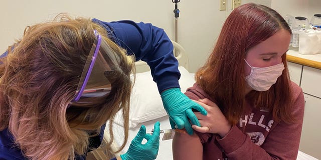 A 16-year-old patient receives a dose of Pfizer's coronavirus vaccine candidate at the Cincinnati Children's Hospital. (Photo courtesy of Cincinnati Children’s)